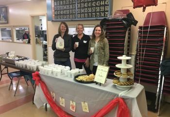 Members of St. Theresa, Hellertown Home and School Association preparing to serve milk, hot chocolate and cookies during Student Appreciation Day are, from left, Ali Finkbeiner, Catherine Denzel and Tricia Smith. (Photo courtesy of Jacque Parker)