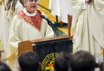 Father David Loeper, left, chaplain at Nativity BVM High School, Pottsville, and Father Christopher Zelonis, pastor of St. Michael the Archangel, Minersville, concelebrate Mass at Nativity as part of CSW celebrations. (Photo by Ed Koskey)