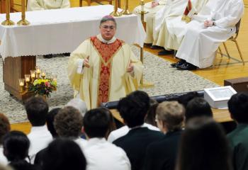 Bishop of Allentown Alfred Schlert speaks with students at Nativity BVM High School, Pottsville Feb. 2 while celebrating CSW Mass. (Photo by Ed Koskey)