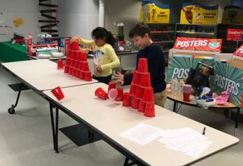 Daniella Awad, left, and Noah Kelly, students at Our Lady Help of Christians School, Allentown compete in a round of cup stacking. (Photo courtesy of Michael Hillegas)
