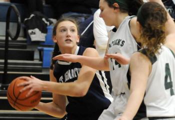 St. Ignatius’ Caroline Reedy (33) tries to get by St. Patrick’s Jillian Guzick (24) and Gillian Blankenhorn (4) during semi-finals.