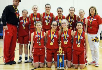 St. Thomas More is the grade school girls’ champion. From left are: front, Ava Hull, Kaitlyn Ewing, Carly Rohrbach and Madison Woodward; back, head coach Dan Reichenbach, Jillian Schmidt, Julia Roth, Jadyn Hagadeus, Emma DiComes, Grace Kane and coach Ann Vaughan.