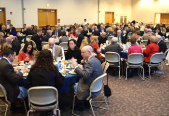 Guests enjoy the festive evening, which garnered $240,000 to help those in need.