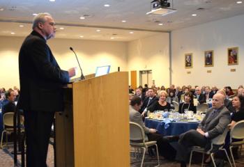 Msgr. John McCann addresses the gathering.