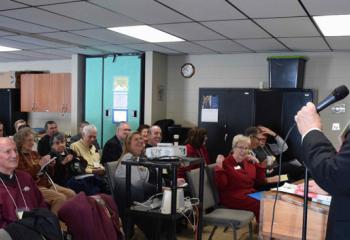 Archbishop Kurtz discusses the importance of being a welcoming parish during a workshop.