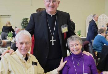 Jeffrey and Anne Blacker reunite with Archbishop Kurtz, who presided at their marriage ceremony 35 years ago.