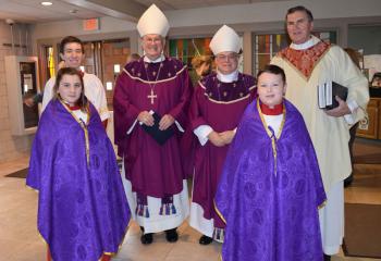 Preparing for the processional for the Lenten Mass, are, from left: front altar servers Meg Freeman and Gavin Hagenbuch; back, altar server Neil Maydick, Archbishop Joseph Kurtz, Bishop Alfred Schlert and Msgr. Robert Wargo.  