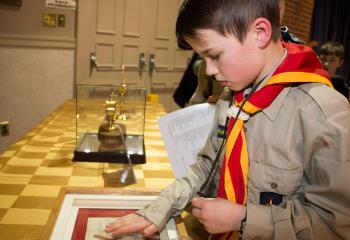 Joseph Lloyd venerates a relic to receive spiritual grace. 