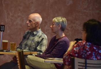 A couple listens to the evening presentation sponsored by the Diocesan Office of Adult Formation.