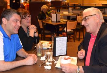 Deacon Anthony Campanell, right, chats during the break with Delphy DeFalcis and his wife Joanne, parishioners of St. Joseph the Worker, Orefield. 