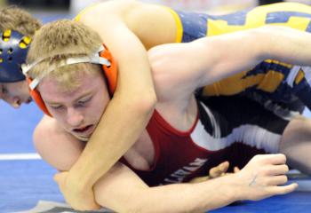 Ryan McGuire, top, controls his opponent Nathan Higley, Sullivan County High School, Laporte, for a 4-0 shutout and fifth place in the 132-pound Class AA tournament.
