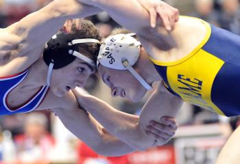 Richie Markulics, right, Notre Dame High School (NDHS), Easton, looks for a takedown on his way to a 3-2 victory for third place in the 120-pound bout. 