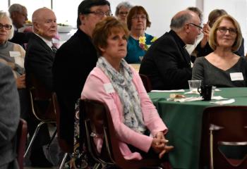 BAA supporters watch a video depicting services, programs and ministries funded by BAA.