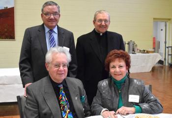 Faithful from St. Peter, Coplay enjoying the kickoff are, from left: front, Mike and Beverly Sobchak; back, Robert Hauke and Msgr. John Martin, pastor.