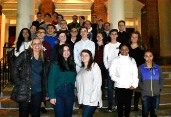 The youth groups from Notre Dame of Bethlehem and Queenship of Mary, Northampton exit their visitation to the cathedral and head to another Diocesan church after Holy Thursday services.