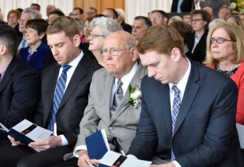 Members of Father Greenfield’s family participating in the Mass of Missioning are his father, “Bud” Greenfield, third from left, and nephews, from left, Tim Greenfield, Matt Greenfield and Andrew Greenfield.