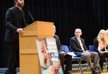 Father Stephan Isaac, assistant pastor of St. Ignatius Loyola, Sinking Spring, welcomes guests and supporters of life at the expo and festival.