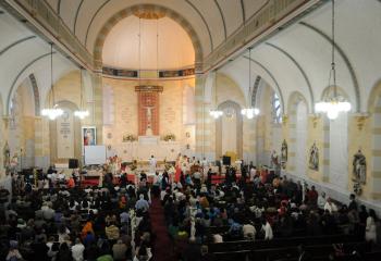 Faithful receive Communion at the Divine Mercy Healing Center and the former church building of St. Joseph, Easton.