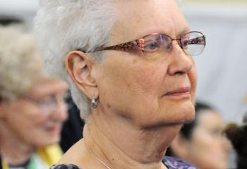 Shirley Schroeder, 81, a life-long member of the former St. Joseph, prays in her former church during its reopening as a healing center.