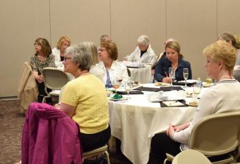 Women listen to the insights of panelists at the complimentary information presentation offered by the Diocese of Allentown.