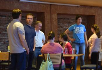 Young adults mingle before the Theology on Tap.