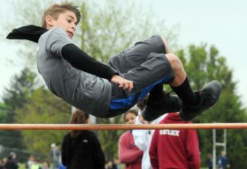 Bryson Walters from St. John Neumann Regional School, Palmerton-Slatington clears the bar as he competes in the high jump.