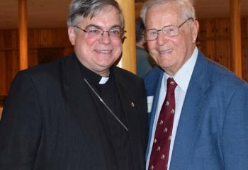 Bishop Alfred Schlert, left, greets Thomas McBride, parishioner of Immaculate Conception, Jim Thorpe. The theme of this year’s appeal is “Called to Serve.”