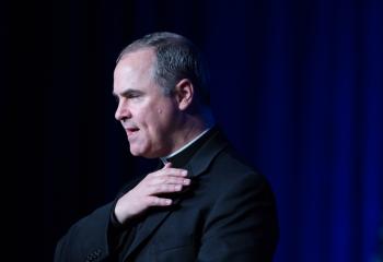 Father Paul Scalia of Arlington, Va., leads the Pledge of Allegiance during the National Catholic Prayer Breakfast May 24 in Washington. (CNS photo/Tyler Orsburn) 