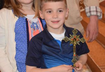 Claire and Francis Kowalonek proudly display the Traveling Vocations Crucifix that they will host as the first family of the initiative.