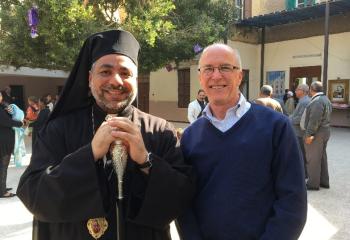 Deacon Joseph Petrauskas, right, greets Bishop Emmaniel Bishaym who was ordained in June 2016. The Bishop served as the Chairman of the Organizing Committee for the visit of Pope Francis in April 2017. The Bishop expressed his appreciation for all that CRS is doing in support of the Interfaith Peacebuilding initiative that is so important for the Christian communities.