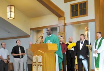 Father Speratus Kamanzi, then Superior General, center, offers appreciation in 2013 for a donation from Knights of Columbus St. Benedict Council 14654, Mohnton of $750 to help the Apostles of Jesus continue support of orphans around the world. Also pictured are, from right: Pastor Father Philip Rodgers, Steve Wagner, George Koch, Matt Clayton, Paul Waterman, Andrew Angstadt and Paul Wirkus. (File photo)