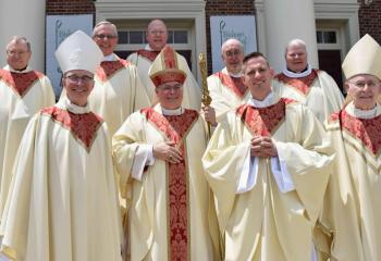 Father Hutta, front third from left, gathers with clergy after his ordination. From left are: front, Bishop Senior, Bishop Schlert and Bishop Cullen; back, Monsignor Francis Schoenauer, cathedral pastor; Monsignor Gerald Gobitas, Diocesan chancellor and secretary for clergy; Monsignor David James, Diocesan vicar general and director of vocations; Monsignor DeSantis; and Father William Campion, pastor of Sacred Heart, Palmerton.