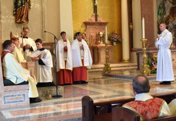 Father Hutta, right, stands before Bishop Schlert during Election of the Candidate.