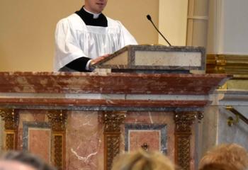 Seminarian Philip Maas offers a reading. 