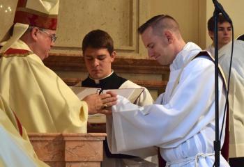 Then Deacon Hutta, right, promises respect and obedience to Bishop Schlert and his successors.