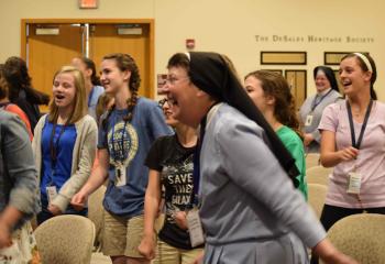 Sisters, Servants of the Immaculate Heart of Mary (IHM) Sister Rose Bernadette Mulligan dances with the girls prior to Mark and Megan Quaranta’s July 17 talk “Fruit of Prayer: Marriage.”