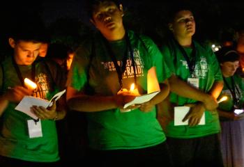 Everyone gathers for the July 18 Stations of the Cross on the campus grounds.