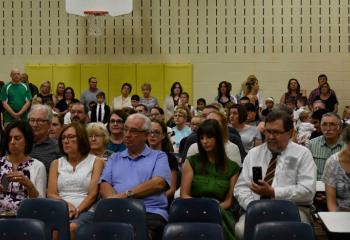 Students, friends and family of SJRS participate in the Mass in the school cafeteria.