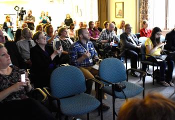 Members of the press, diocesan staff and board of advisors for Kolbe Academy gather at St. Francis Center for Renewal for the press conference announcing the establishment of the first Catholic school for recovery and addiction in the United States.