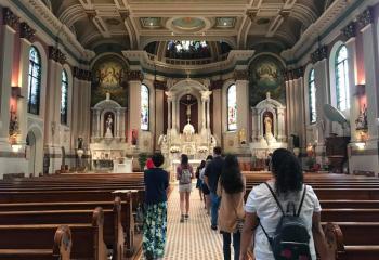Right, young adults explore the upper church at St. John Neumann Shrine during the daylong event. 