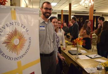 Andrew Ivankowits volunteers at the information table for Juventutem Lehigh Valley, an international movement of young Catholics who share a love of the extraordinary form of the Mass.