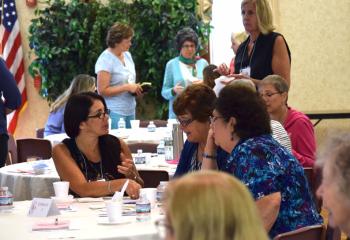 Women take time to chat during a break.