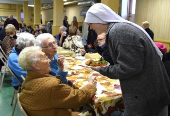 Sister Anna Grace, right, chats with Dorothy Kamaroski, center, and Theresa Tunitta. 