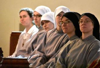 Members of the Community of Franciscan Sisters of the Renewal, Bronx, New York listen to the homily about the Jesuit priest and Shenandoah native.