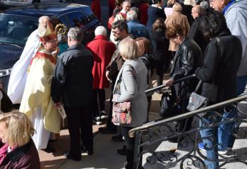 Bishop Schlert greets the faithful after Mass.