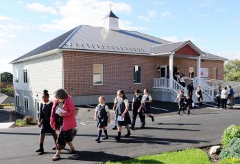 Students exit after touring new the building.