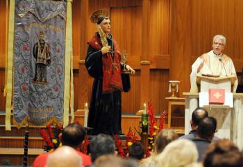 Father Stanley Moczydlowski, pastor of St. Anthony of Padua, Easton, preaches the homily during Mass.