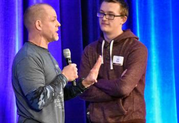 Doug Barry, left, husband and father of five, and founder and director of the Catholic ministry RADIX, discusses the importance of self-defense with Keith Neidig, student at Bethlehem Catholic High School.