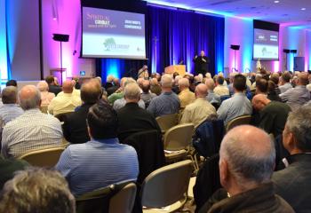Father Allen Hoffa, administrator of St. Joseph, Summit Hill, welcomes men to the conference.