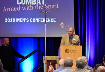 Mike Barski, member of the diocesan Commission for Men, introduces Father Hoffa.